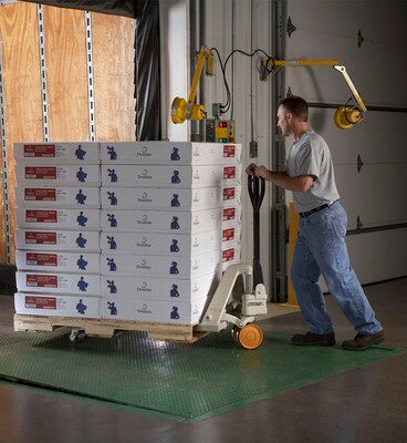 An image of a man using a Hand Pallet Jack
